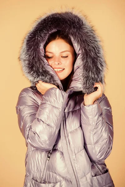 Faux fur. Fashion girl winter clothes. Fashion trend. Fashion coat and hat. Warming up. Casual winter jacket slightly more stylish and have more comfort features such as larger hood fur trim on hood