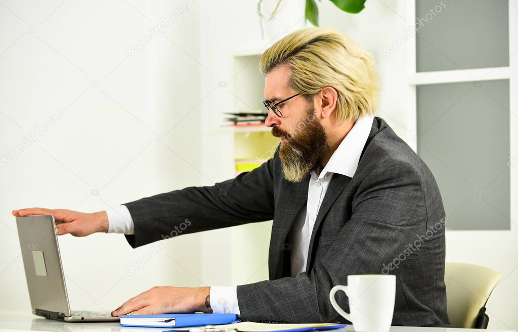 Business conference. distant work while coronavirus quarantine. mature school teacher. Business-minded businessman. bearded man in jacket with laptop. boss in workplace. modern office life