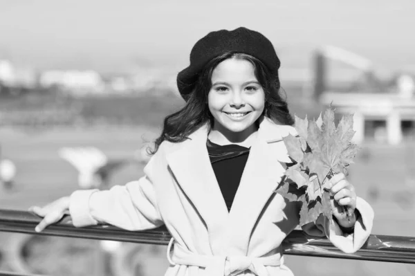 Trendy beauty. school time. maple syrup. canada. happy small girl. autumn kid fashion. child maple leaf. kid in french beret. leaf fall. favorite season. good weather mood. parisian girl trendy look
