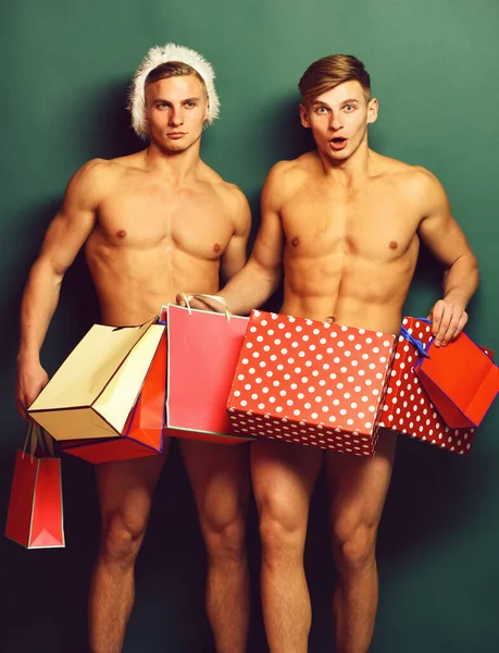 Knappe macho santa tweeling — Stockfoto