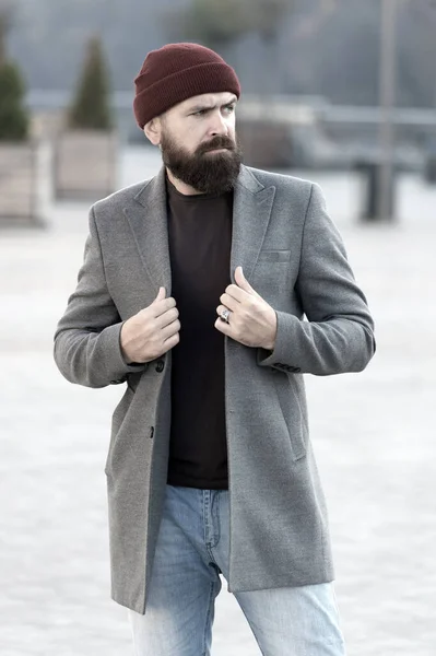 Stylish and comfortable. Man bearded hipster posing confidently in