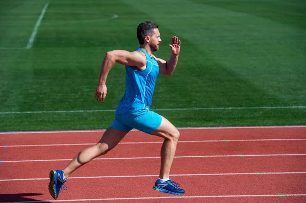 Great progress. muscular guy run to success. man running on stadium. sports healthy lifestyle routine. sport workout. male athlete do morning exercise. sportsman runner outdoor. health care. energy — Stock Photo, Image