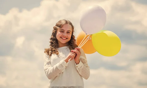 Happy birthday party. small girl with party balloon. summer holidays and vacation. childhood happiness. feeling free and carefree. little kid in spring holiday. cheerful child have fun — Stock Photo, Image