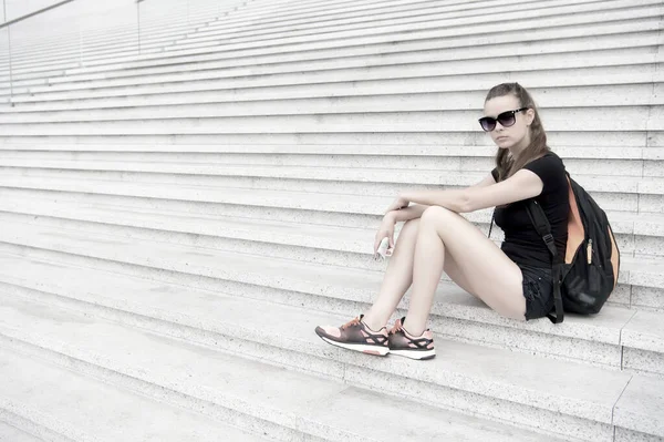 Urban space. Tourist guide sightseeing. Vacation ideas. Vacation in big city. Woman relaxing. Museum university building. Girl student sit stairs. Explore city. Vacation and travel concept. Waiting