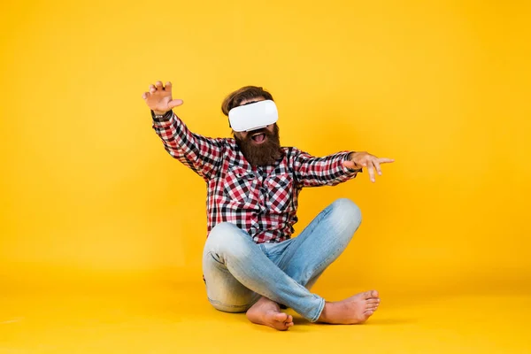 So real. Future technology concept. Visual reality concept. guy getting experience using VR-headset glasses. bearded hipster use modern technology. man with glasses of virtual reality