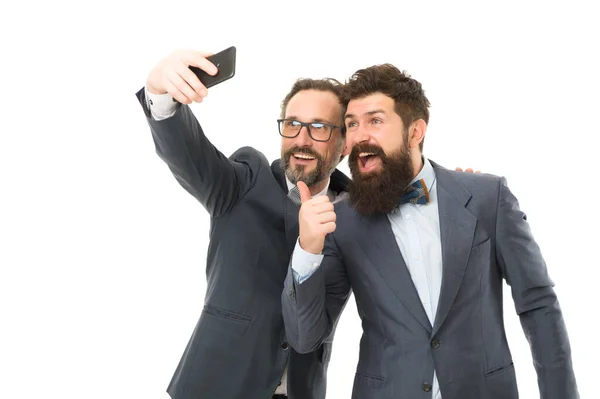 Mature men making selfie. Agile business. collaboration and teamwork. partnership of men speaking on phone. bearded businessmen in formal suit. business communication on meeting. team success — Stock Photo, Image