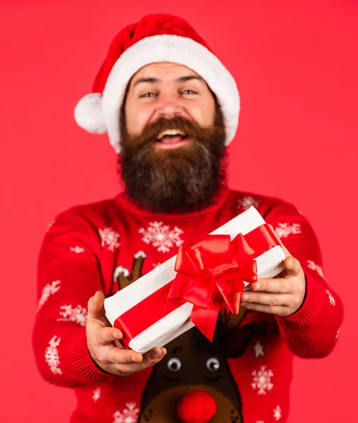Open present. Christmas gift. Boxing day. Keep calm and winter on. Prosperity and wellbeing. Shopping concept. Santa Claus bearded man. Merry Christmas. Christmas surprise tradition. Spreading warmth
