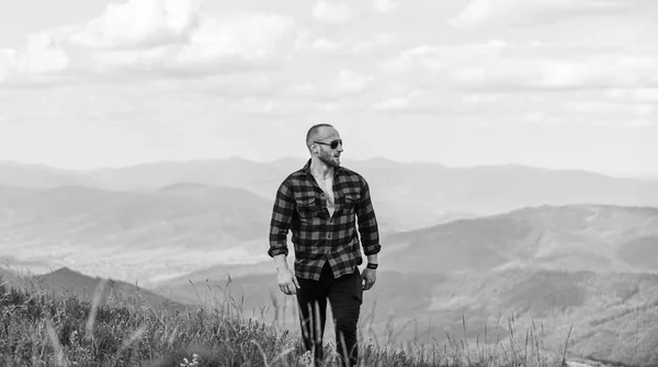 Masculine power. Tourist walking mountain hill. Power of nature. Man stand on top of mountain landscape background. Hiking concept. Discover world. Masculinity and male energy. Natural power