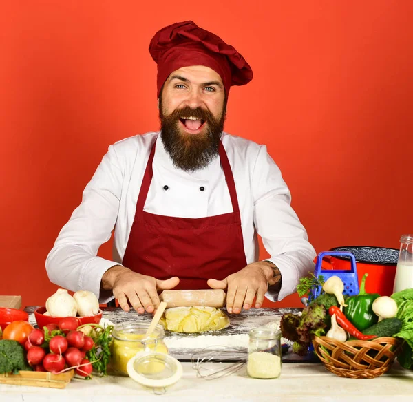 Chef with spices, vegetables and dough on table. — Stock Photo, Image