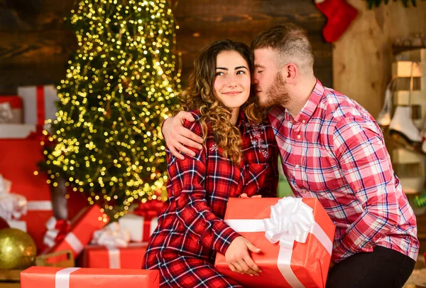 True love. Happiness and joy. Best holiday. Christmas time. Celebrate new year at home. Spread love. Happy woman and man. Holiday gift. Holiday mood. Couple in love making surprise for each other