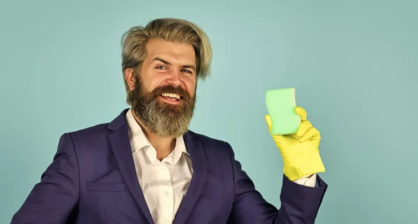 clear business. housekeeping and cleaning concept. House cleaning. bearded man doing housework and cleaning. handsome businessman with washing gloves. use sponge and detergent for floor cleaning