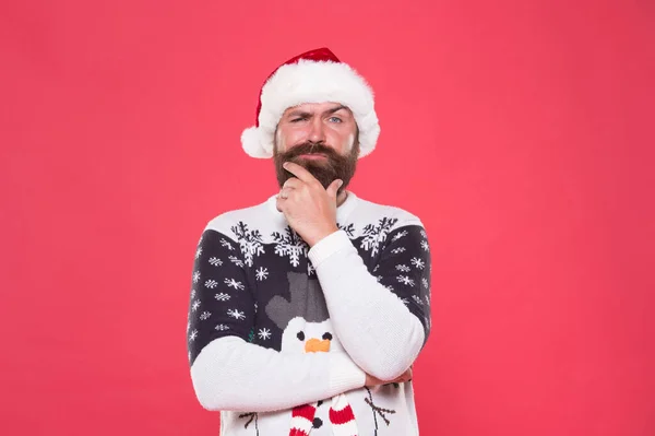 Serious bearded man in warm knitted sweater and santa claus hat celebrate winter holiday of new year and feel merry about xmas gifts, winter holiday and vacation — Stock Photo, Image