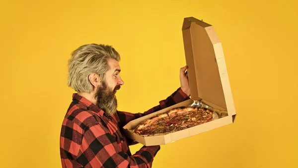 Cooking food concept. giving food order and holding pizza. hungry man eating pizza. fast food Delivery. eating delicious cheesy pizza. happy bearded man italian food. italy is here — Stock Photo, Image