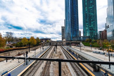 Railroad urban transport. Urban train rail. Rail for metro. Railway station with city skyscraper cityscape. Urban modern cityscape. Metro railway station.