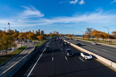 Chicago, Illinois, USA - October 25, 2024: City road full of car. Urban autumn. Urban road way highway. Car traffic on autumn road highway. City destination highway. Fall season. Road way with car.