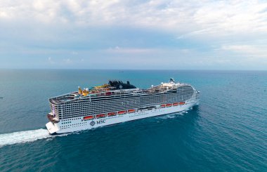 Miami, Florida, USA - May 10, 2025: MSC cruises cruise line. Cruise ship tour and travel at sea. Ship leaving port. MSC World America cruise ship voyage. Cruise in summer vacation. Sea trip.