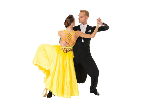 Ballroom dancer dancing waltz. Couple dancing waltz. Ballroom dancer couple. Dancing waltz couple. Dancer classic dance. Competitive dance duo. Dance couple isolated on white. Spinning movement.