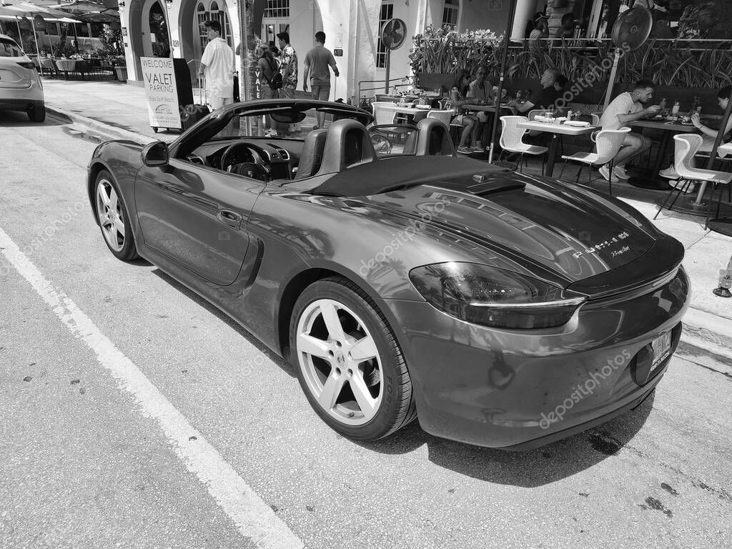 Miami Beach, Florida USA - June 8, 2024: 2018 Porsche 718 Boxter blue color at miami beach. luxury car porshche at ocean drive Miami beach. side view