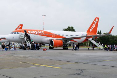 BERLIN, GE - AGOUST 2019 - Easyjet boeing boarding and ready for departure at Berlin Shonfeld airport, Germany. clipart