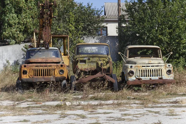 Five abandoned old non-working Soviet lorries