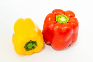 yellow and red fresh bell peppers, on white background clipart