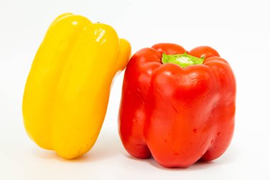 yellow and red fresh bell peppers, on white background clipart