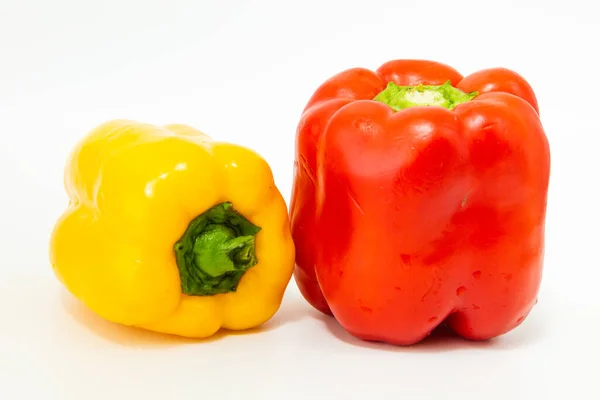 Yellow and red fresh bell peppers, on white background — Stock Photo, Image