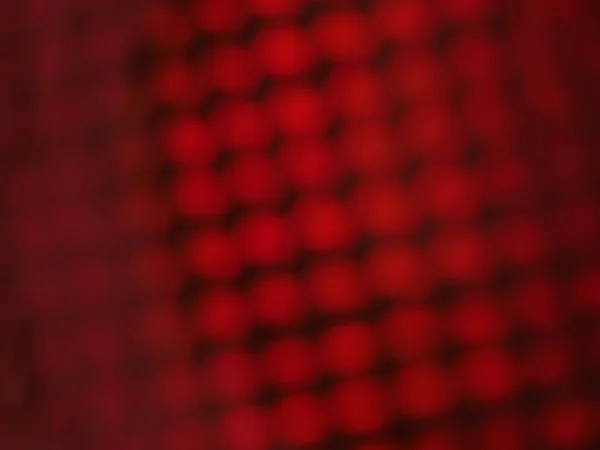 Holografische kleurrijke rode lampjes feestelijke achtergrond — Stockfoto