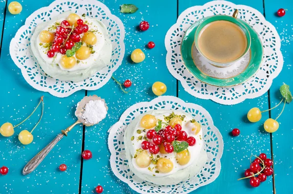 Cake Pavlova with Matcha tea and fresh berries, selective focus