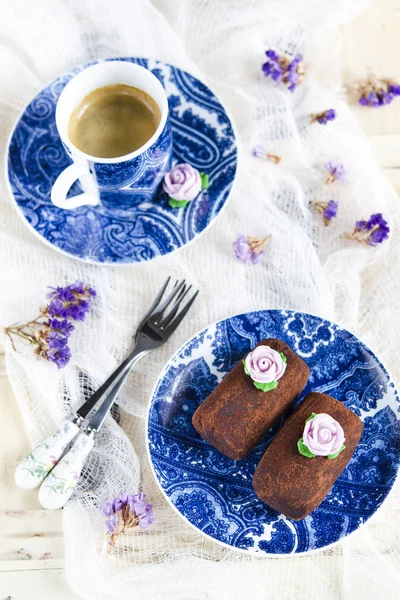 sweet chocolate cake on blue plate