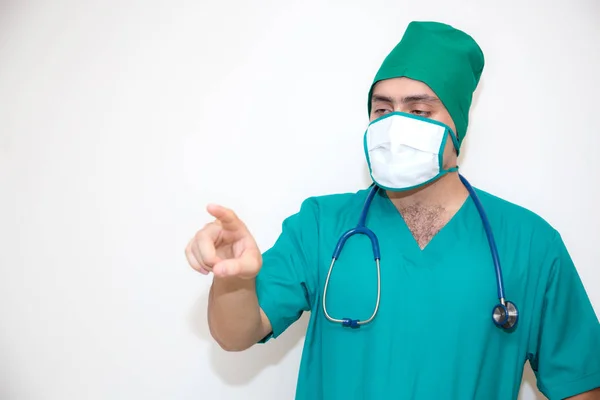 Doctor man pointing on something -  isolated on white background — Stock Photo, Image