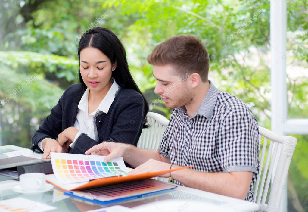 young business people making meeting and looking at document for