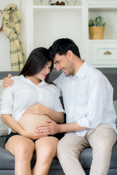 Beautiful pregnant asian woman and husband together care her pre — Stock Photo, Image