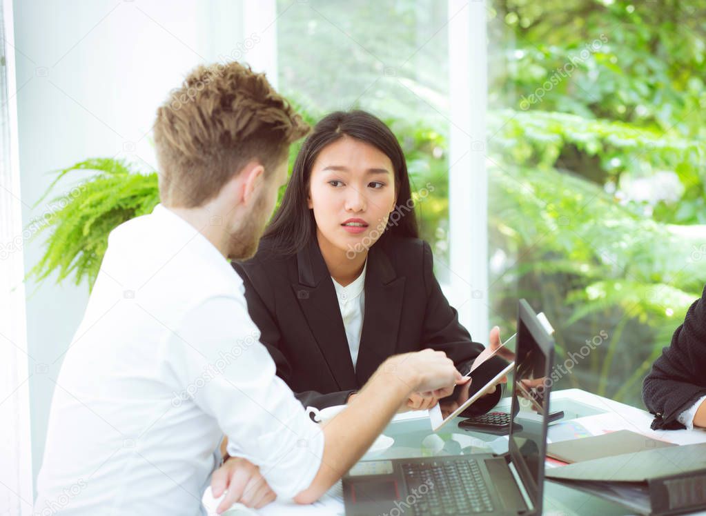 business man and woman people making meeting and looking at tabl