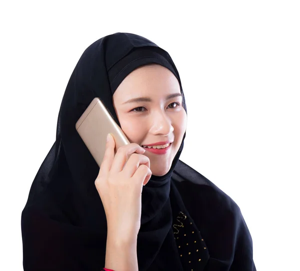 Beautiful muslim woman talking on phone isolated on white backgr — Stock Photo, Image