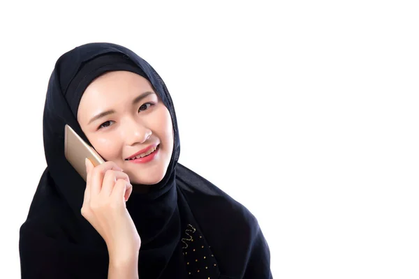 Beautiful muslim woman talking on phone isolated on white backgr — Stock Photo, Image