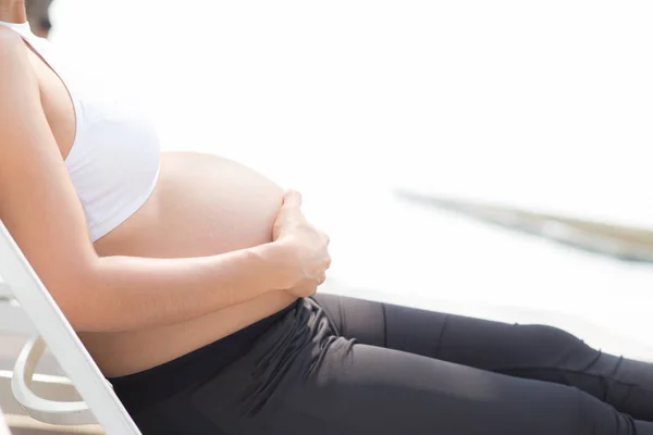 Closeup beautiful pregnant asian young woman relax in the park, — Stock Photo, Image