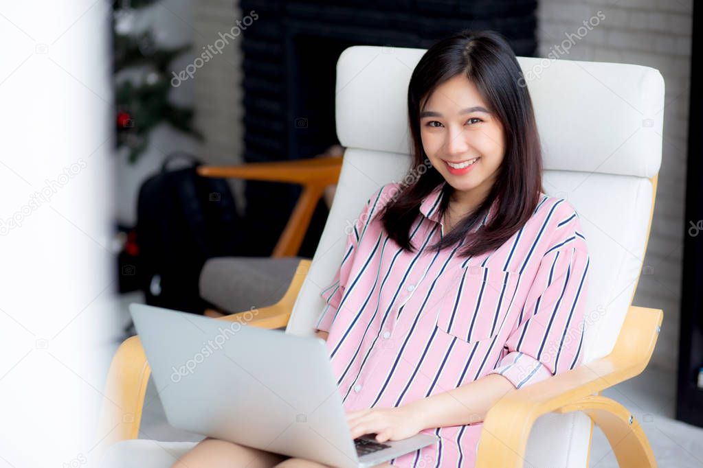 Beautiful of portrait asian young woman working online laptop wi