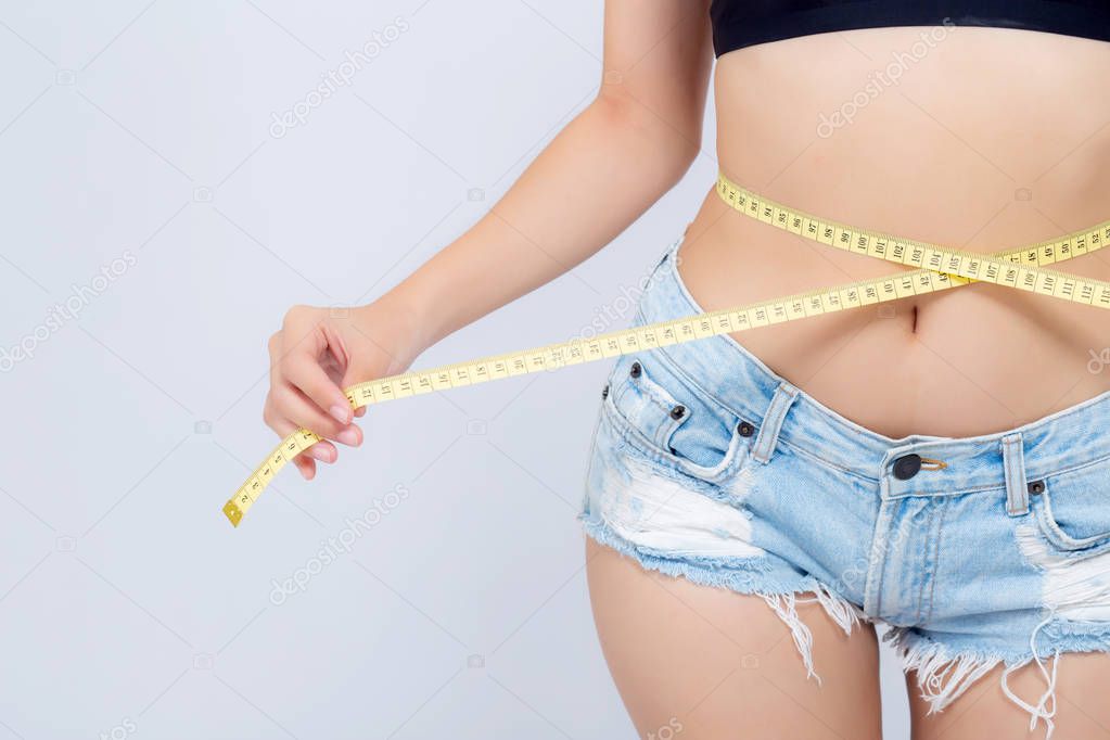 Asian woman diet and slim with measuring waist for weight isolat