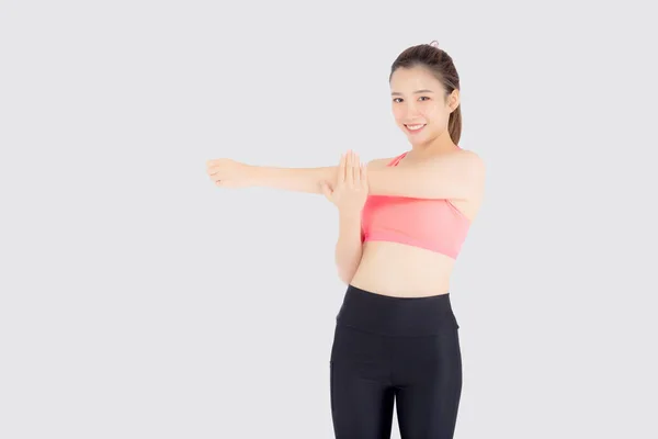 Красивый портрет молодой азиатской женщины, стоящей растянуть мышцы руки — стоковое фото