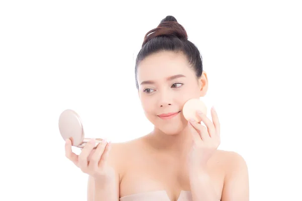 Portrait of beautiful asian woman applying powder puff at cheek — Stock Photo, Image