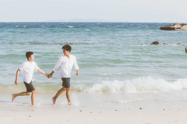 Homosexual portrait young asian couple running with cheerful tog — Stock Photo, Image