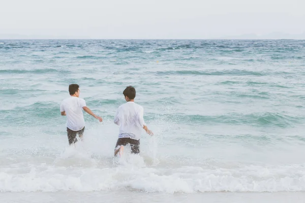 Homosexual portrait young asian couple running with cheerful tog — ストック写真