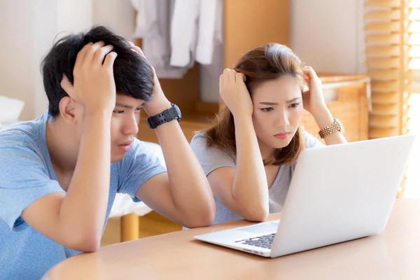 Young asian couple stressed and worried about finance of problem