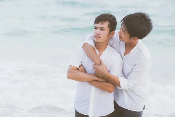 Homosexual portrait young asian couple standing problem on beach