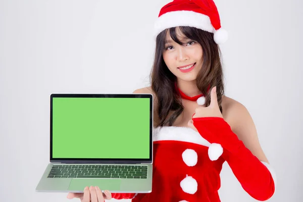 Piękny młody Azji kobieta w Santa prezentuje laptop komputer — Zdjęcie stockowe