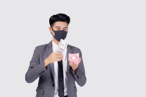 Joven Hombre Negocios Asiático Máscara Cara Celebración Dinero Dólar Alcancía — Foto de Stock