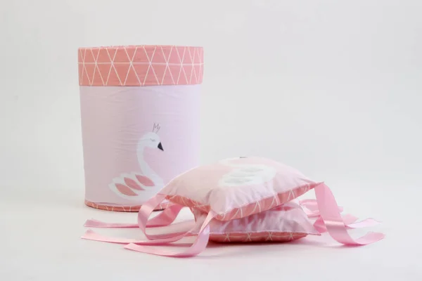 textiles for newborns in the photo Studio on a white background, the side of the pillow in a baby bed, blankets are transformed into envelopes for a walk, a cocoon for a comfortable and safe sleep of