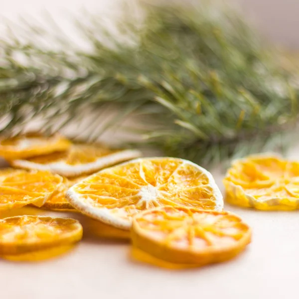 a variety of dried fruits, dried apples, dried tomatoes, dried plum, dried plums, dried kiwi, dried banana, dried oranges, dried pear, dried melon, fruit patty. Slices of fruit in various compositions and with sprigs of Christmas tree