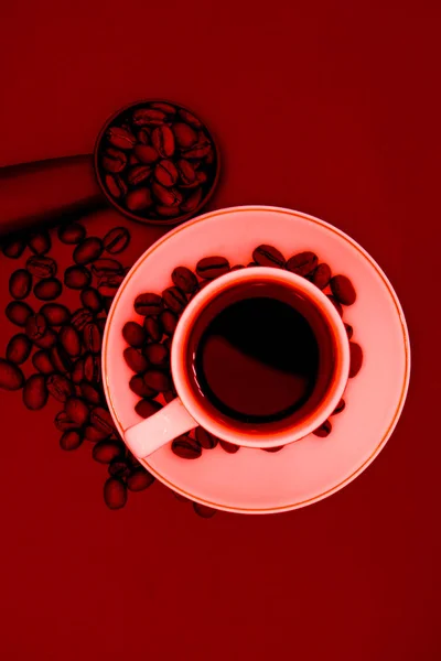 Picture of black coffee in a white cup on a red background — Stock Photo, Image